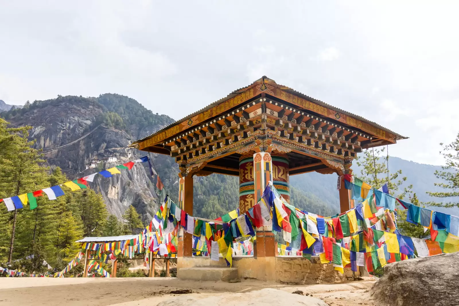 a giant prayer wheel at the ascent to the tiger