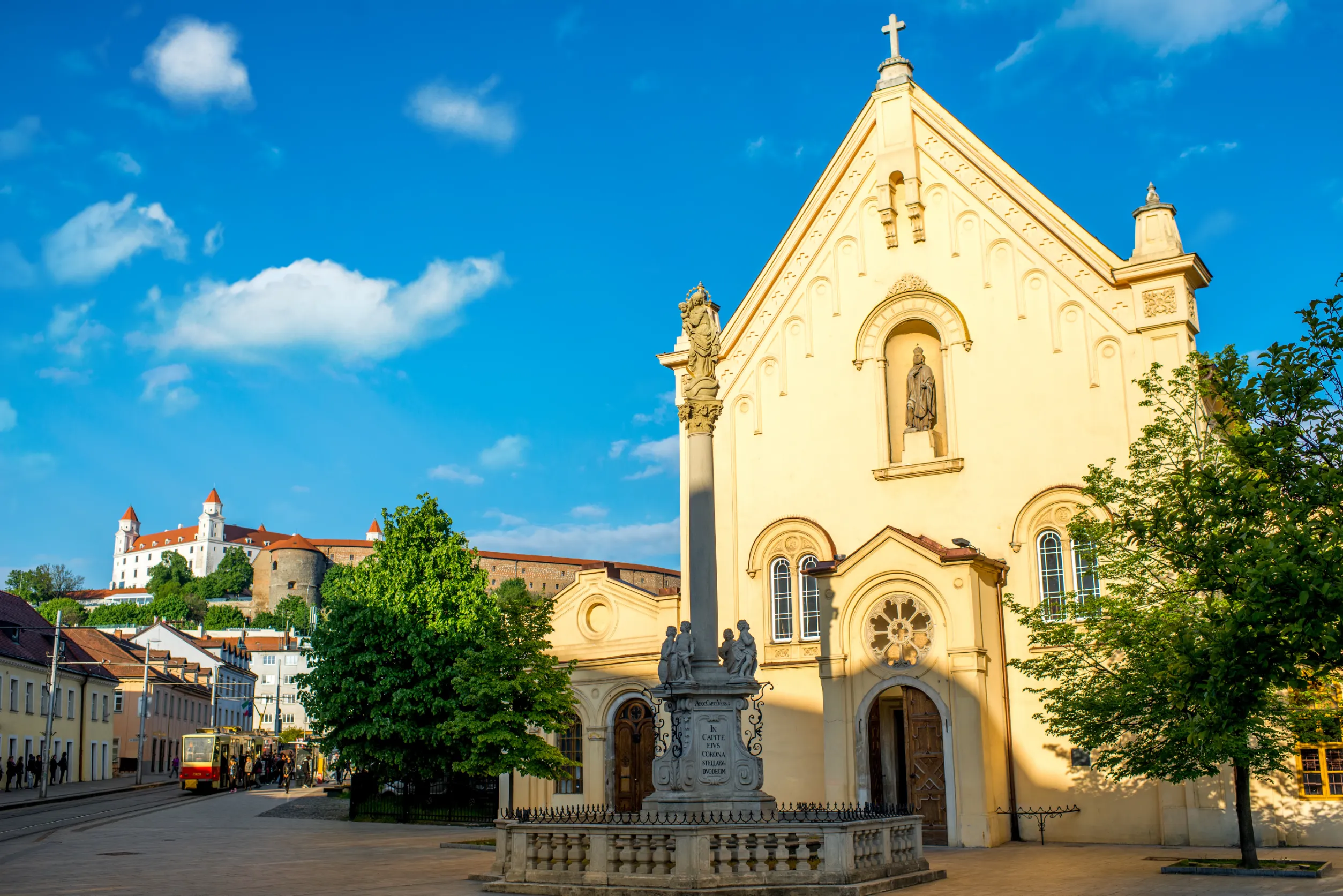capuchin church with castle hill on the background in bratislava capuchin church with castle hill on the background in bratislava