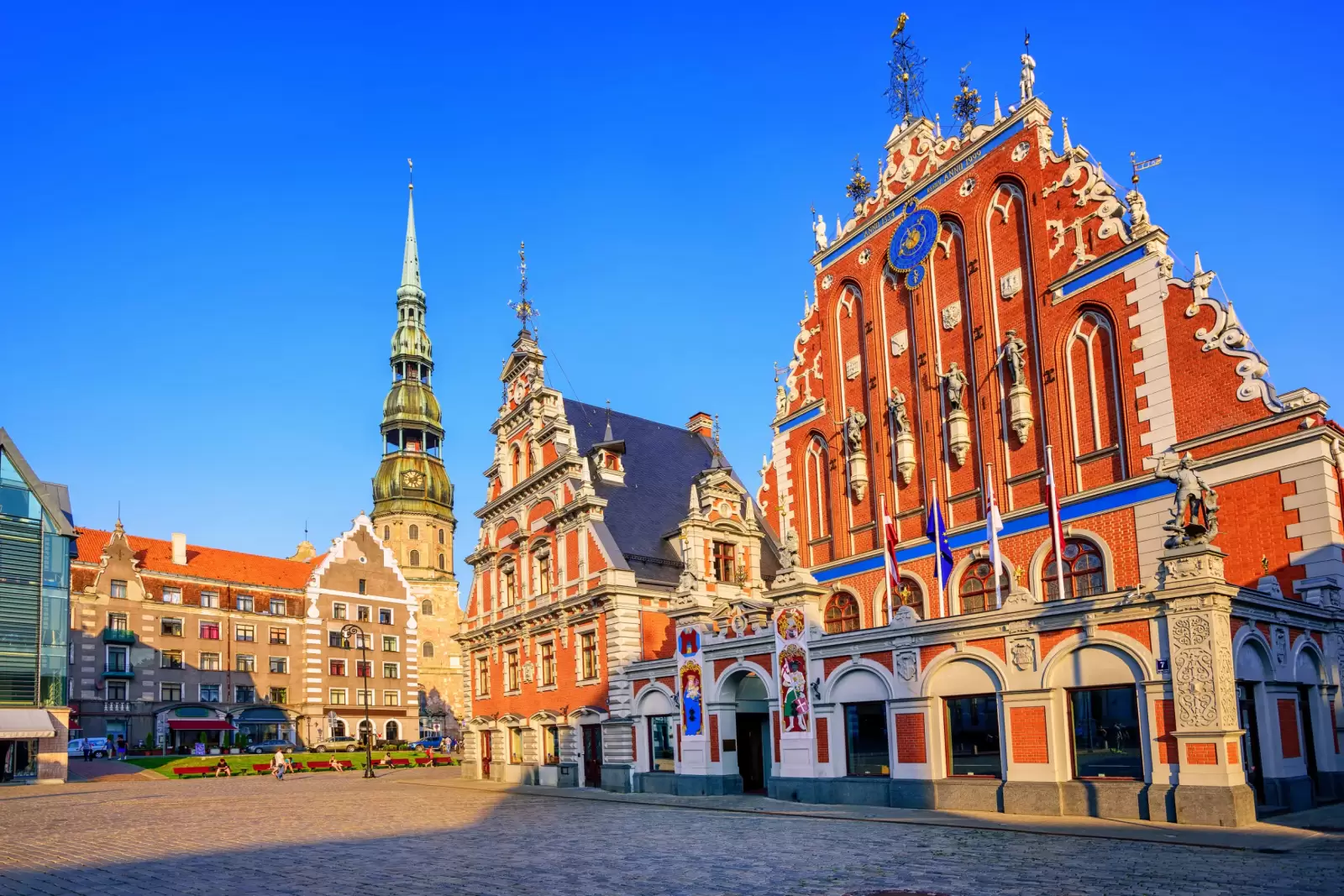 city hall square with house of the blackheads and saint peter church in old town of riga