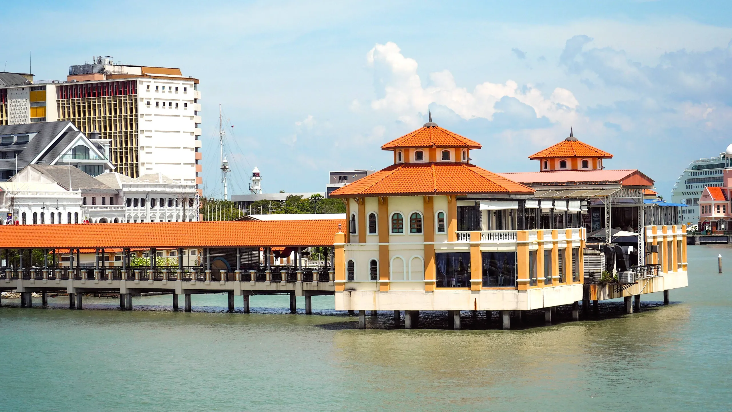 commercial ships in port with sea and blue sky and clouds background in penang commercial ships in port with sea and blue sky and clouds background in penang