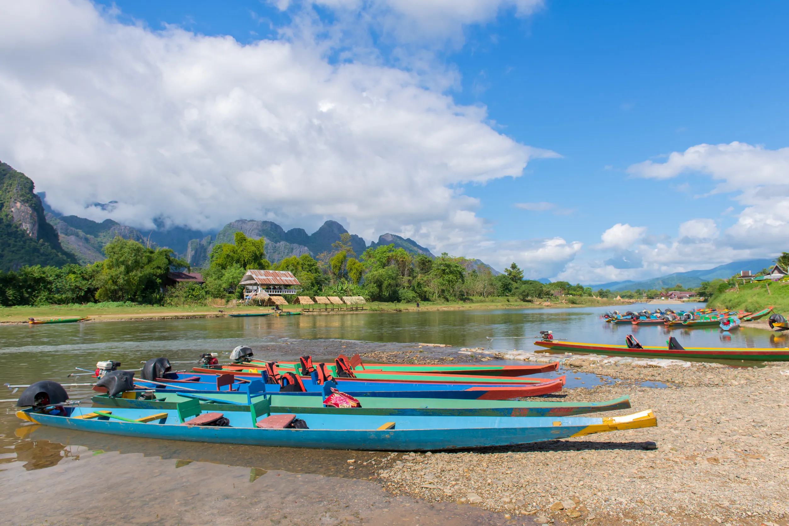 long tail boats song river vang vieng laos long tail boats song river vang vieng laos