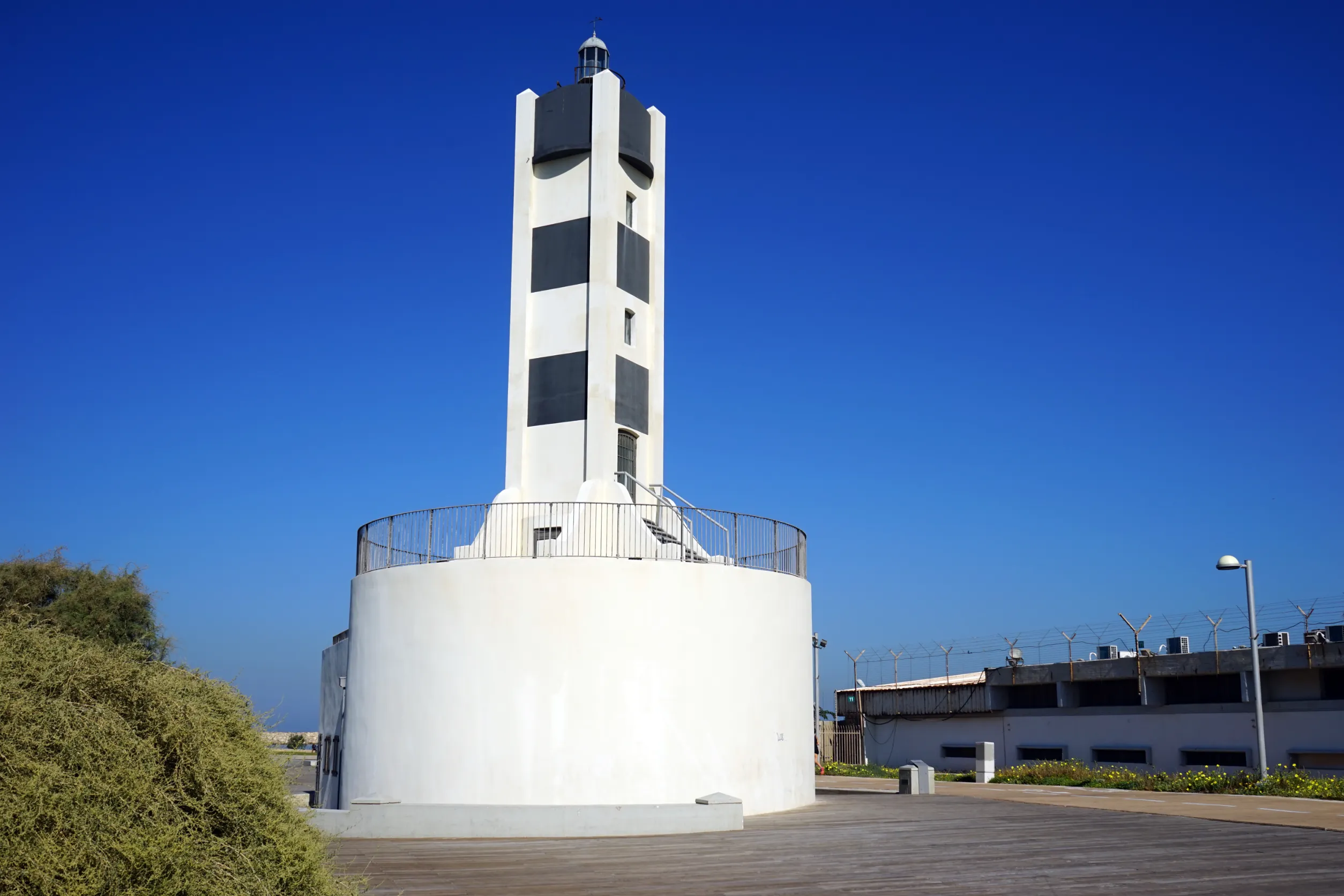 old light tower near power station in tel aviv israel old light tower near power station in tel aviv israel