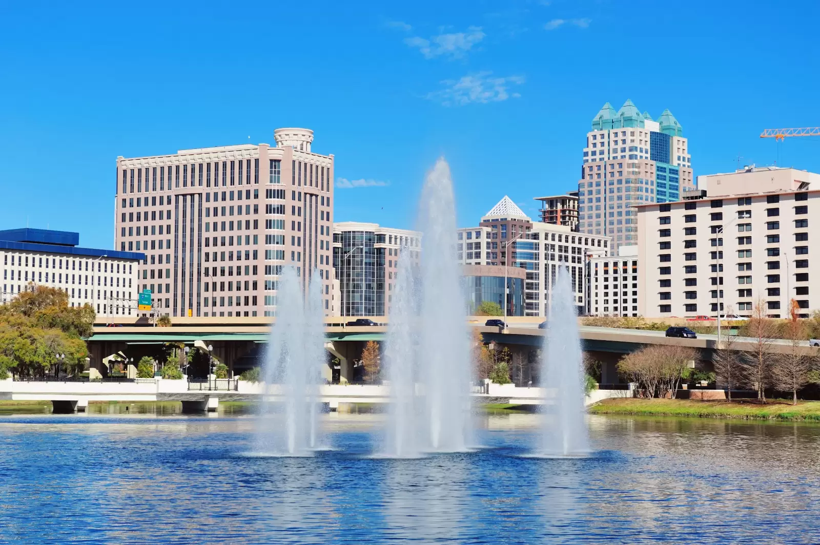 orlando lake lucerne panorama in the morning with office buildings bridge and fountain orlando lake lucerne panorama in the morning with office buildings bridge and fountain
