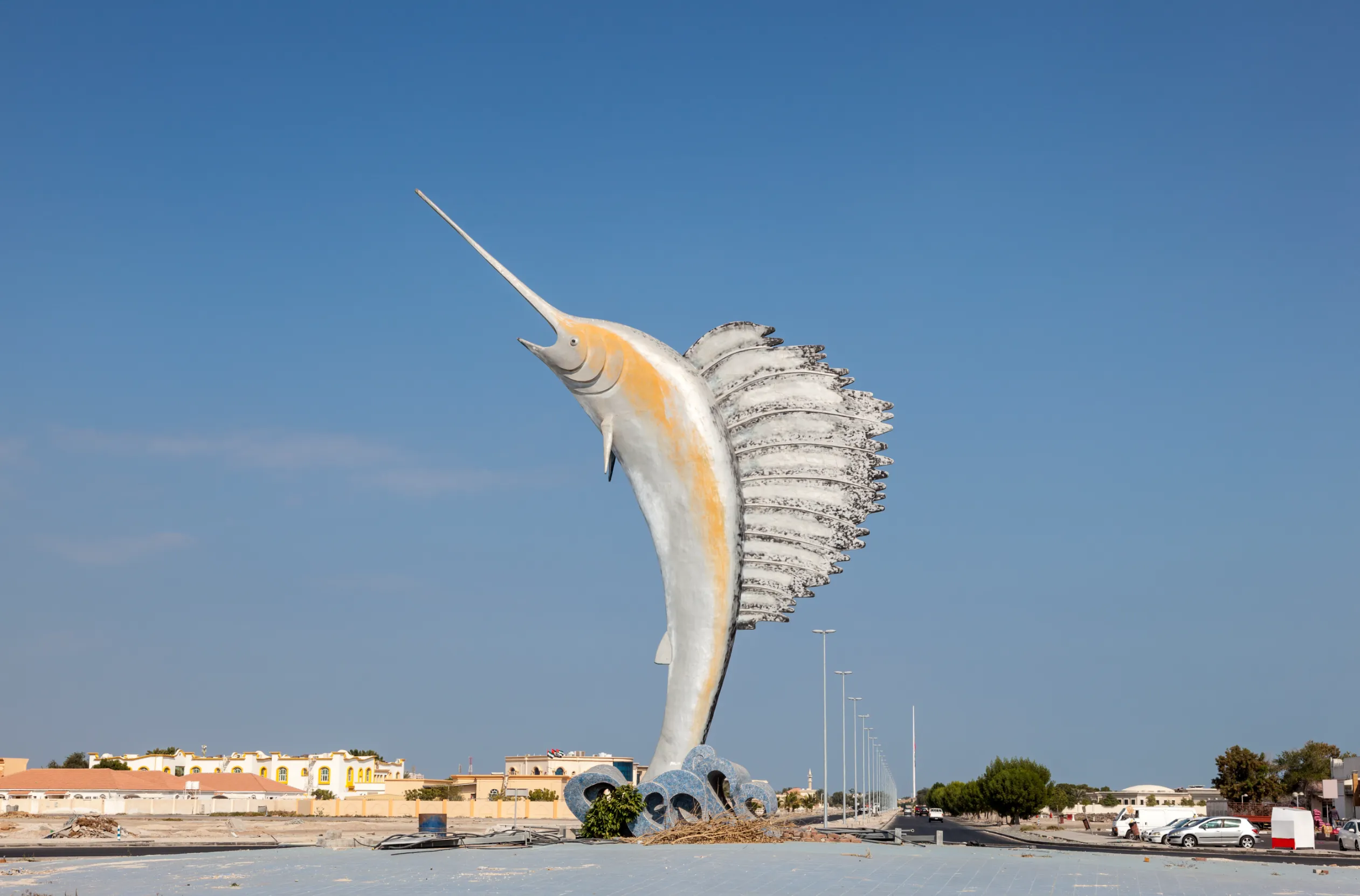 sailfish statue in a roundabout in umm al quwain united arab emirates