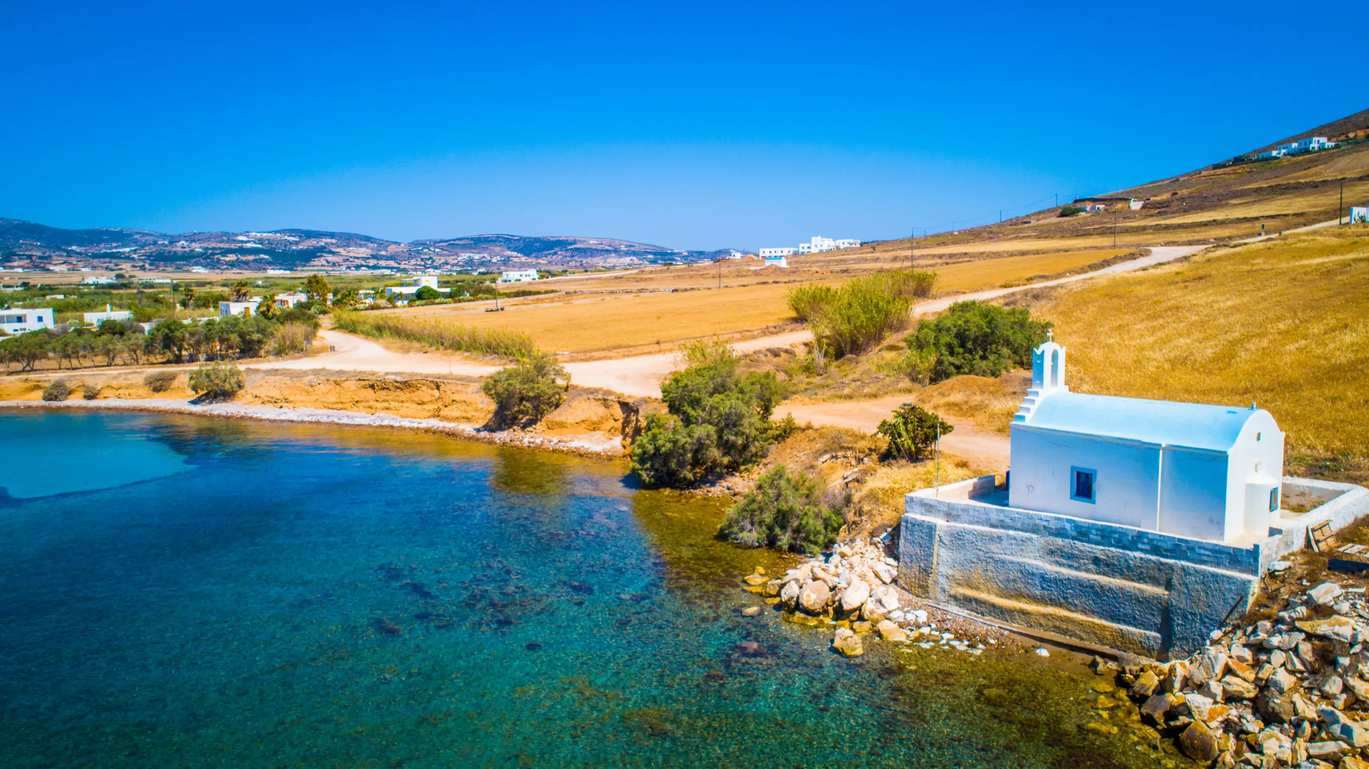 small greek church on a shore line of paros island greece small greek church on a shore line of paros island greece
