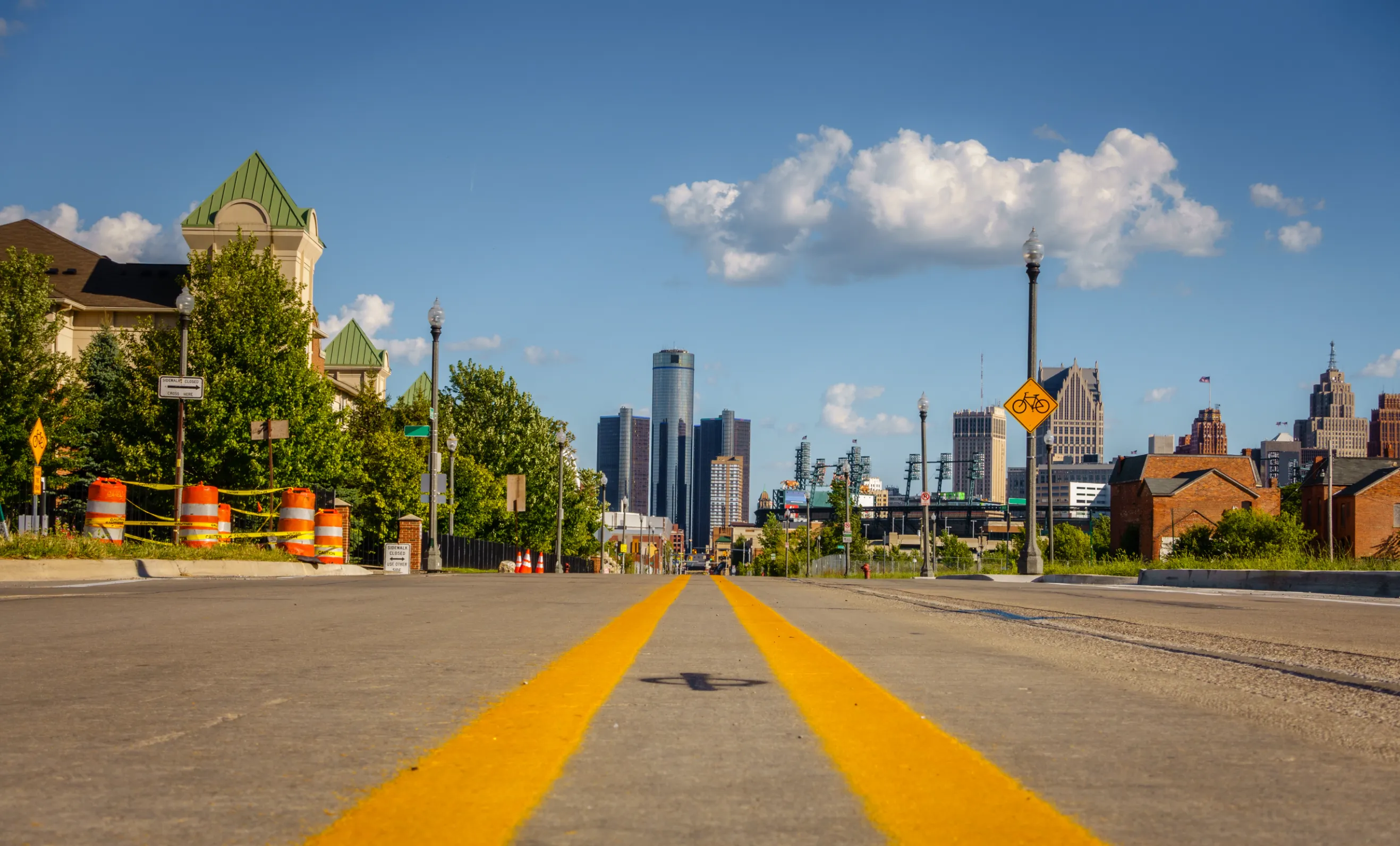street through an old detroit city neighborhood with downtown