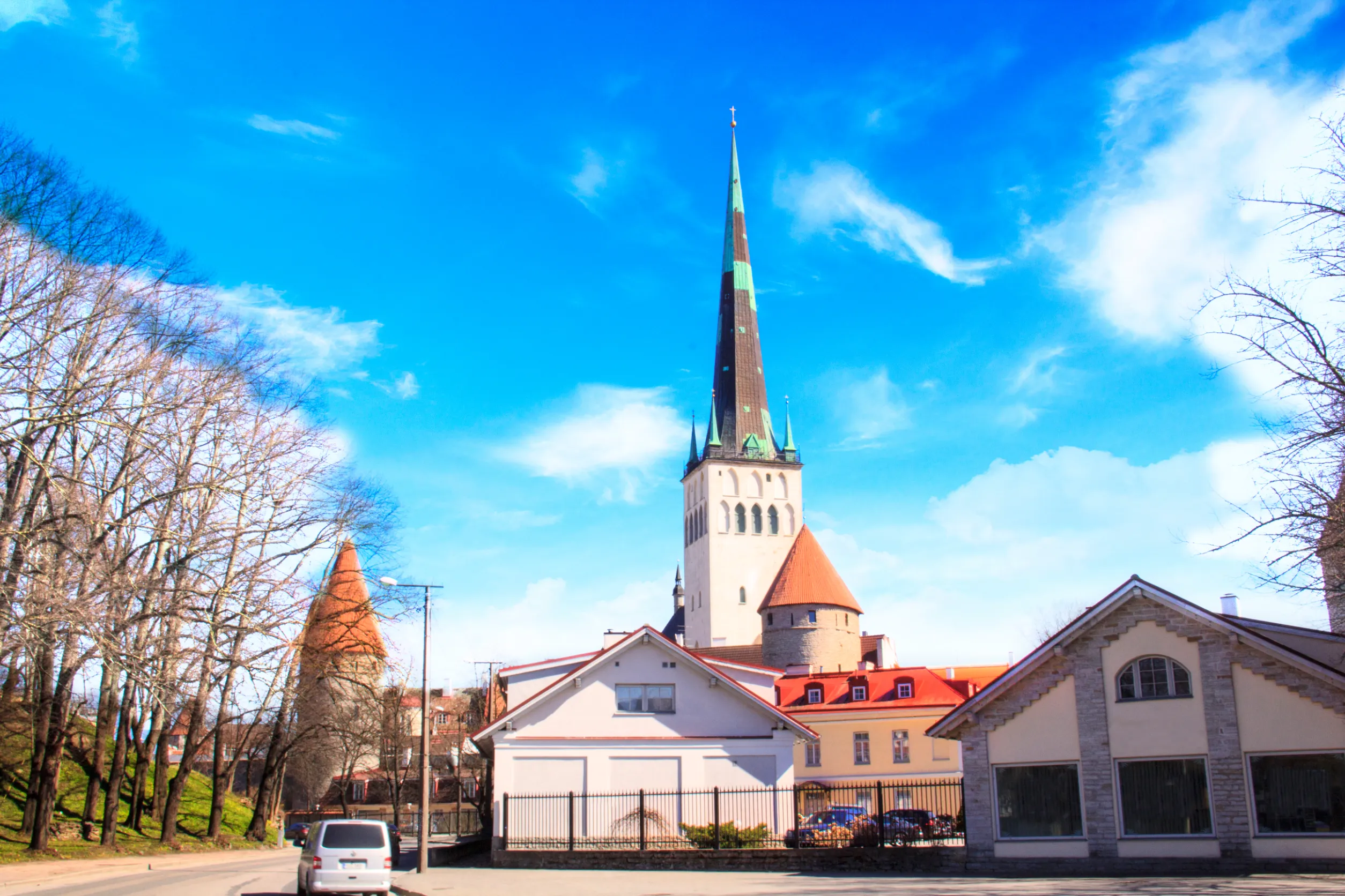 tower oleviste church and the fortress wall in tallinn estonia tower oleviste church and the fortress wall in tallinn estonia