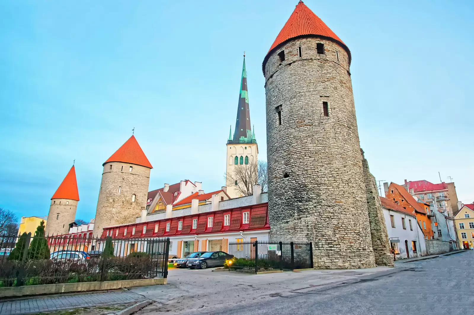 towers of the city wall and st olaf church in the old city of tallinn towers of the city wall and st olaf church in the old city of tallinn